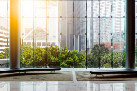 An office window overlooking buildings