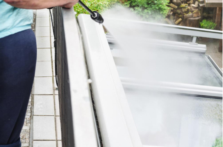 Power washing exterior of a building